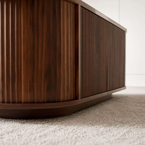 Ovalt Salongbord with a rich walnut finish, showcasing modern design and elegant ribbed texture.